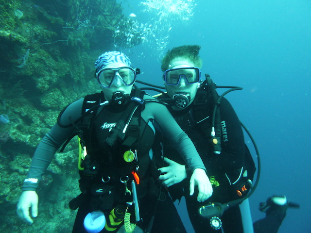 2 SCUBA divers under water.